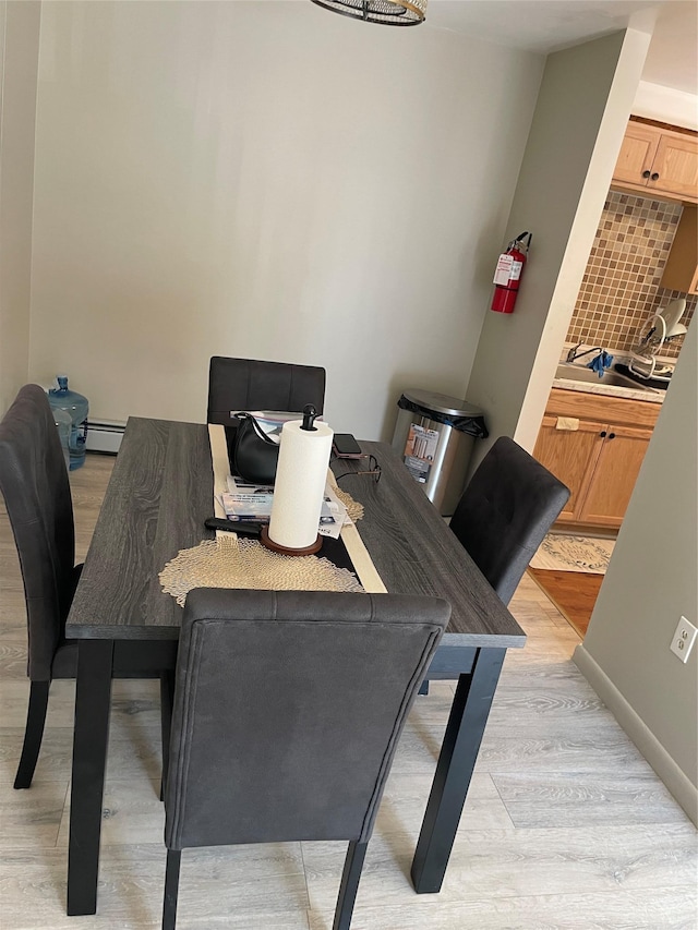 268 Concord Ln, Middletown, NY 10940 - dining room featuring light wood-style flooring, baseboards, and baseboard heating