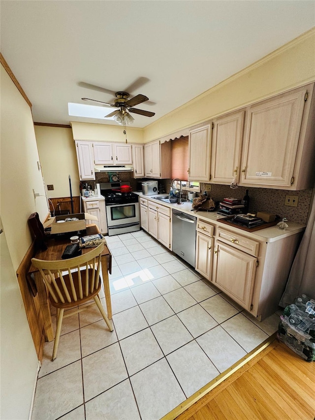 8 Hom St, Chester, NY 10918 - kitchen with stainless steel appliances, a sink, ceiling fan, under cabinet range hood, and ornamental molding