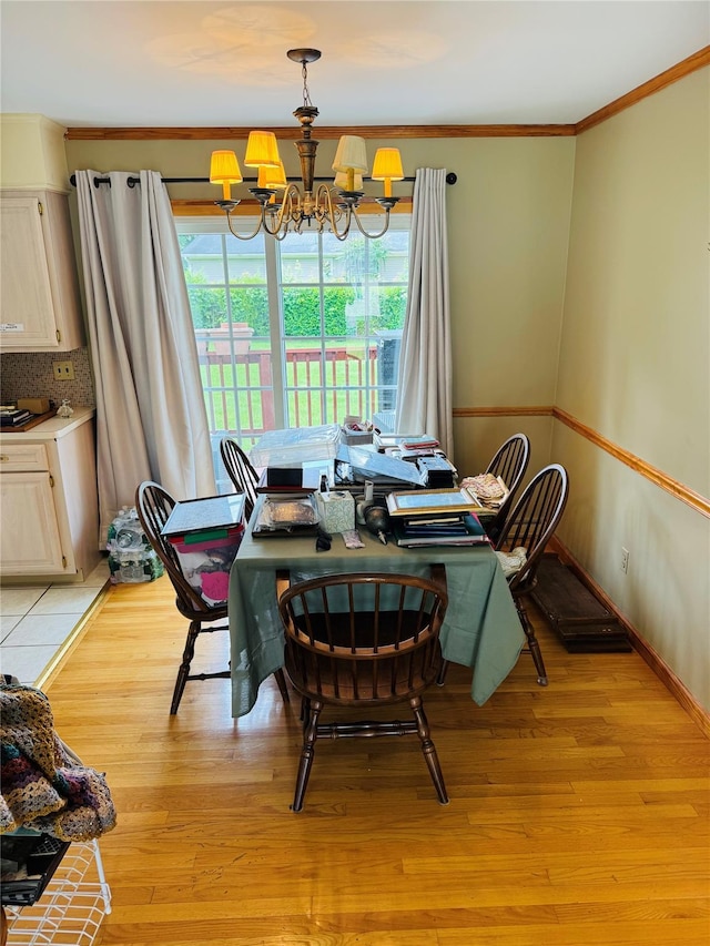 8 Hom St, Chester, NY 10918 - dining space featuring a chandelier, crown molding, light wood-style floors, and baseboards