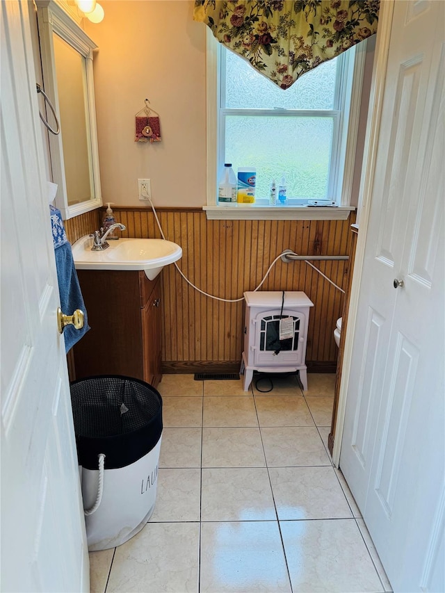 8 Hom St, Chester, NY 10918 - bathroom with wainscoting, vanity, heating unit, wood walls, and tile patterned flooring