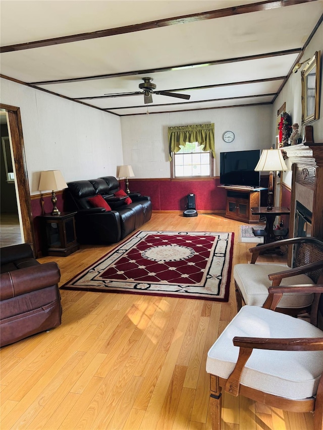 8 Hom St, Chester, NY 10918 - living room with wood finished floors, ceiling fan, a glass covered fireplace, and beam ceiling
