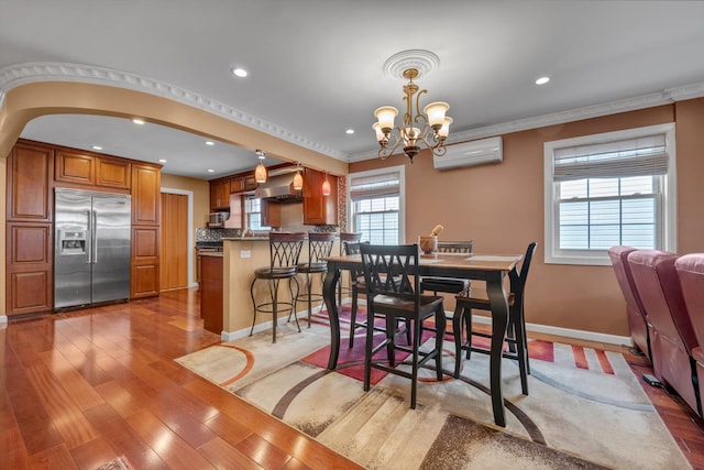 90 Milford St, Brooklyn, NY 11208 - dining area featuring an AC wall unit, healthy amount of natural light, a chandelier, recessed lighting, and light wood-type flooring