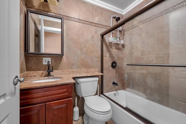 90 Milford St, Brooklyn, NY 11208 - full bathroom featuring tile walls, toilet, shower / bath combination with glass door, vanity, and ornamental molding