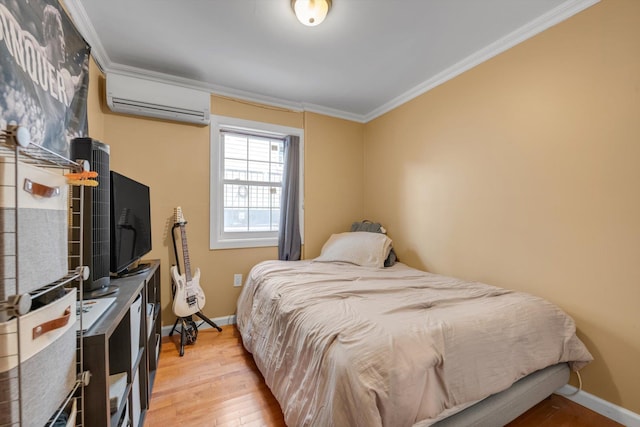 90 Milford St, Brooklyn, NY 11208 - bedroom featuring an AC wall unit, light wood finished floors, crown molding, and baseboards