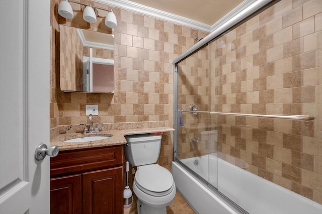 90 Milford St, Brooklyn, NY 11208 - bathroom featuring vanity, bath / shower combo with glass door, toilet, tile walls, and crown molding