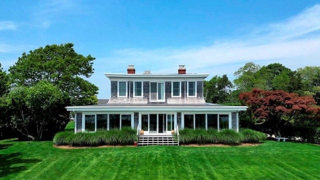 150 Senix Ave, Center Moriches, NY 11934 - back of property featuring a chimney, a lawn, and a sunroom