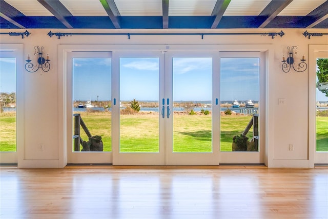 150 Senix Ave, Center Moriches, NY 11934 - doorway to outside featuring beam ceiling and wood finished floors