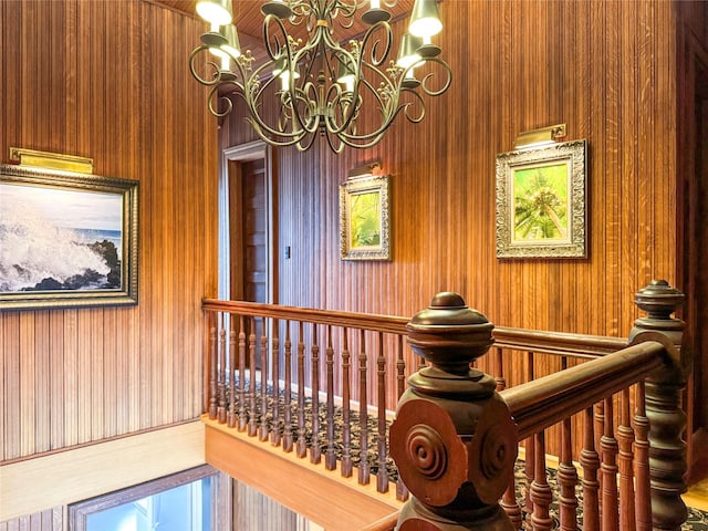 150 Senix Ave, Center Moriches, NY 11934 - staircase with a chandelier and wooden walls