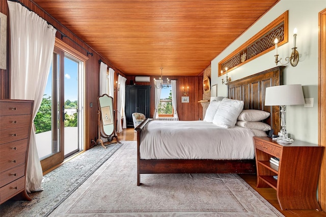 150 Senix Ave, Center Moriches, NY 11934 - bedroom with access to exterior, wooden ceiling, a wall mounted AC, and wood finished floors