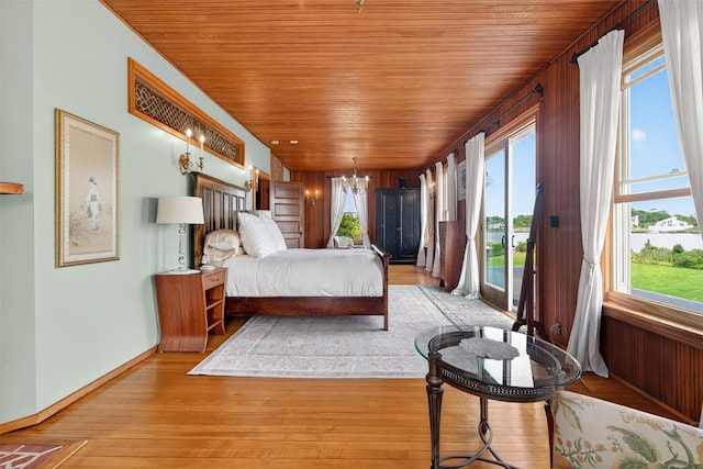 150 Senix Ave, Center Moriches, NY 11934 - bedroom featuring wooden ceiling, access to outside, a chandelier, and light wood-style flooring