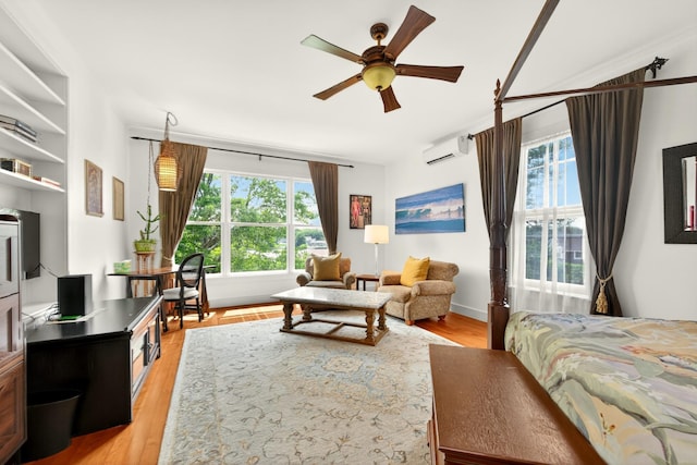 150 Senix Ave, Center Moriches, NY 11934 - bedroom with a wall mounted AC, multiple windows, and light wood finished floors