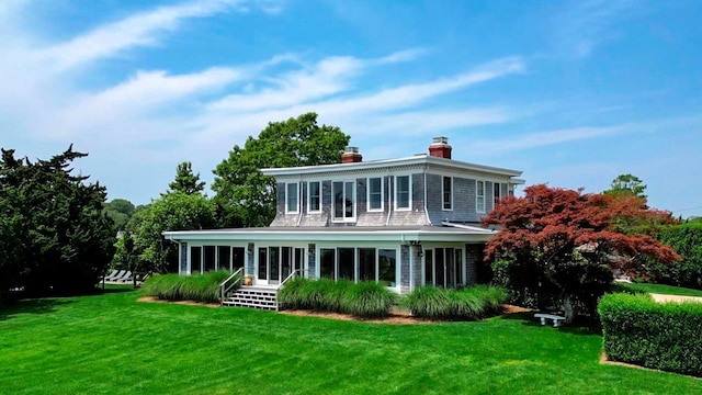 150 Senix Ave, Center Moriches, NY 11934 - back of house featuring a yard and a chimney