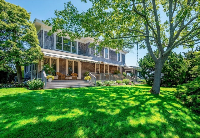 150 Senix Ave, Center Moriches, NY 11934 - back of property with a lawn and covered porch