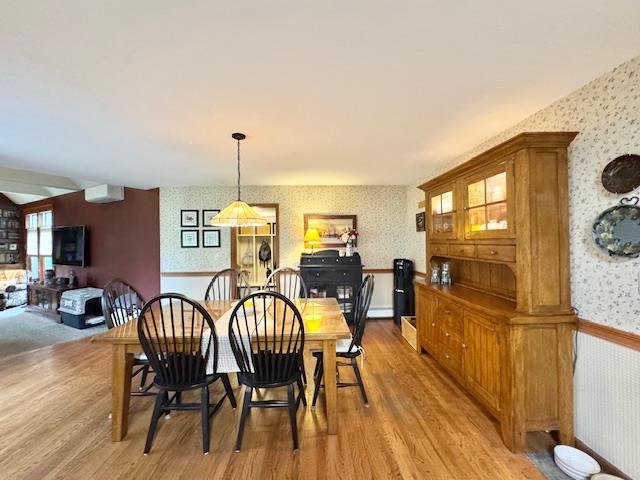 73 Gregory Way, Calverton, NY 11933 - dining area with wallpapered walls and light wood finished floors