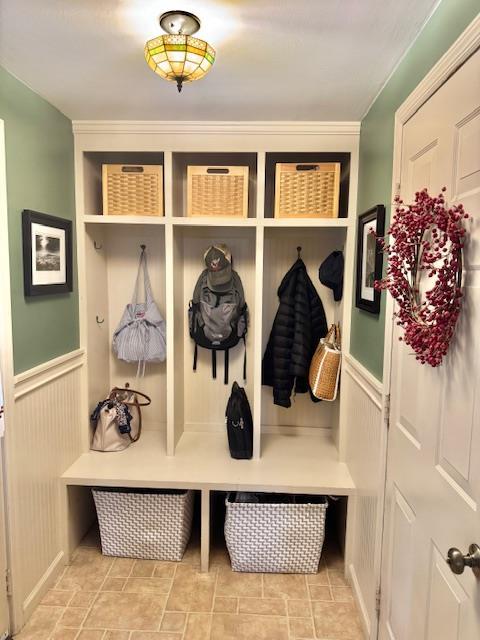 73 Gregory Way, Calverton, NY 11933 - mudroom featuring wainscoting