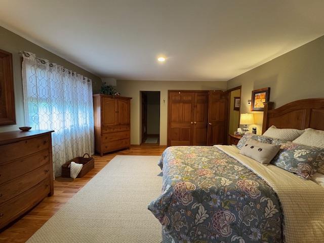 73 Gregory Way, Calverton, NY 11933 - bedroom featuring light wood-type flooring, recessed lighting, and a closet