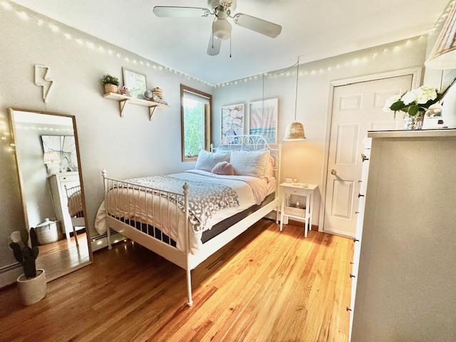 73 Gregory Way, Calverton, NY 11933 - bedroom with light wood-type flooring and ceiling fan