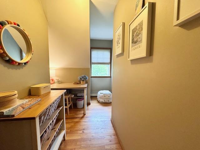 73 Gregory Way, Calverton, NY 11933 - hallway with light wood finished floors and baseboard heating