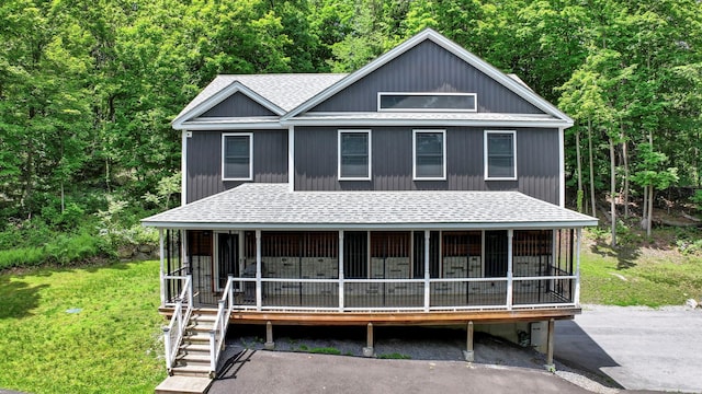 11 Fieldstone Ct, Highland, NY 12528 - view of front of property with roof with shingles, a wooded view, and a front lawn