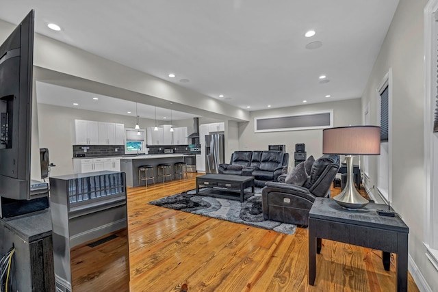 11 Fieldstone Ct, Highland, NY 12528 - living room featuring light wood-style flooring and recessed lighting