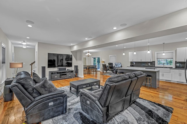 11 Fieldstone Ct, Highland, NY 12528 - living room with light wood-type flooring, a chandelier, and recessed lighting
