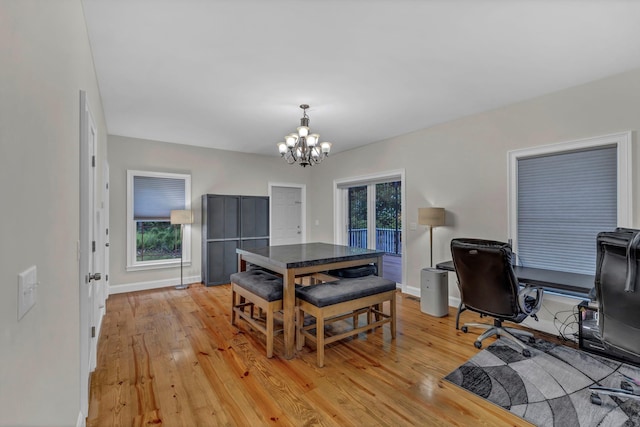 11 Fieldstone Ct, Highland, NY 12528 - dining area featuring a chandelier, light wood finished floors, baseboards, and a desk