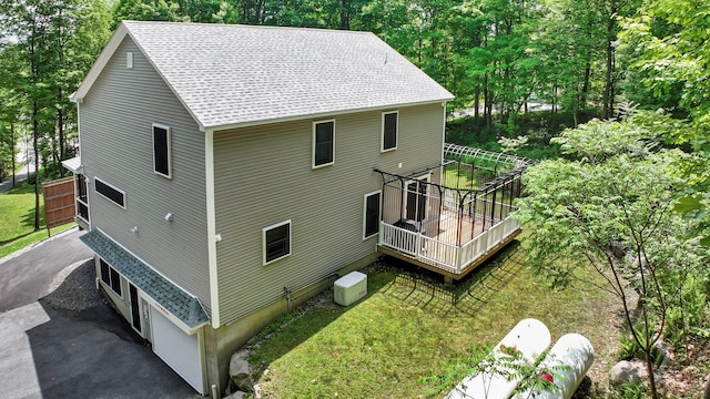 11 Fieldstone Ct, Highland, NY 12528 - view of side of property with a shingled roof and a deck
