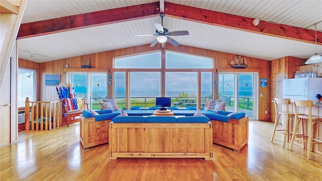 15 Dune Walk, Davis Park, NY 11772 - living room with ceiling fan, wooden walls, and light wood finished floors