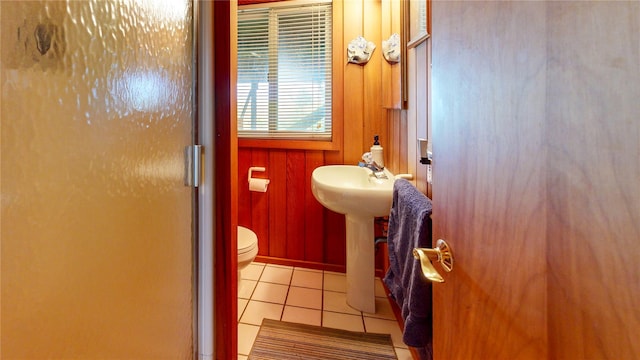 15 Dune Walk, Davis Park, NY 11772 - bathroom featuring a shower with shower door, tile patterned flooring, and wooden walls