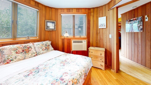 15 Dune Walk, Davis Park, NY 11772 - bedroom featuring wood walls, light wood-style flooring, and a wall mounted air conditioner