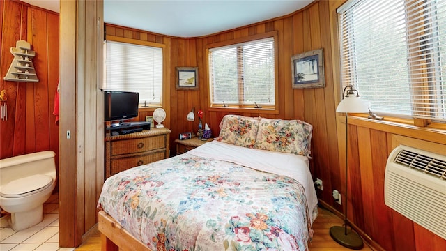 15 Dune Walk, Davis Park, NY 11772 - bedroom featuring wood walls and an AC wall unit
