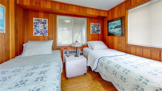 15 Dune Walk, Davis Park, NY 11772 - bedroom featuring wood walls and light wood-type flooring