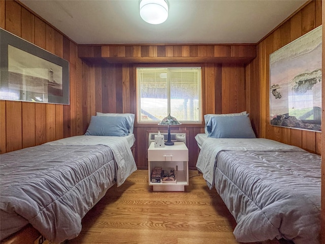 15 Dune Walk, Davis Park, NY 11772 - bedroom featuring wooden walls and light wood-style floors