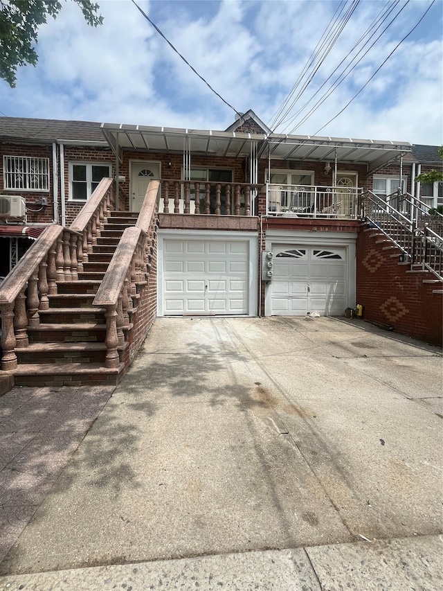 1365 E 99th St, Brooklyn, NY 11236 - multi unit property featuring stairs, concrete driveway, brick siding, and a garage