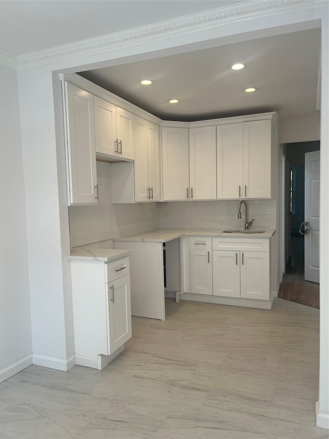 1365 E 99th St, Brooklyn, NY 11236 - kitchen featuring a sink, white cabinets, recessed lighting, tasteful backsplash, and baseboards