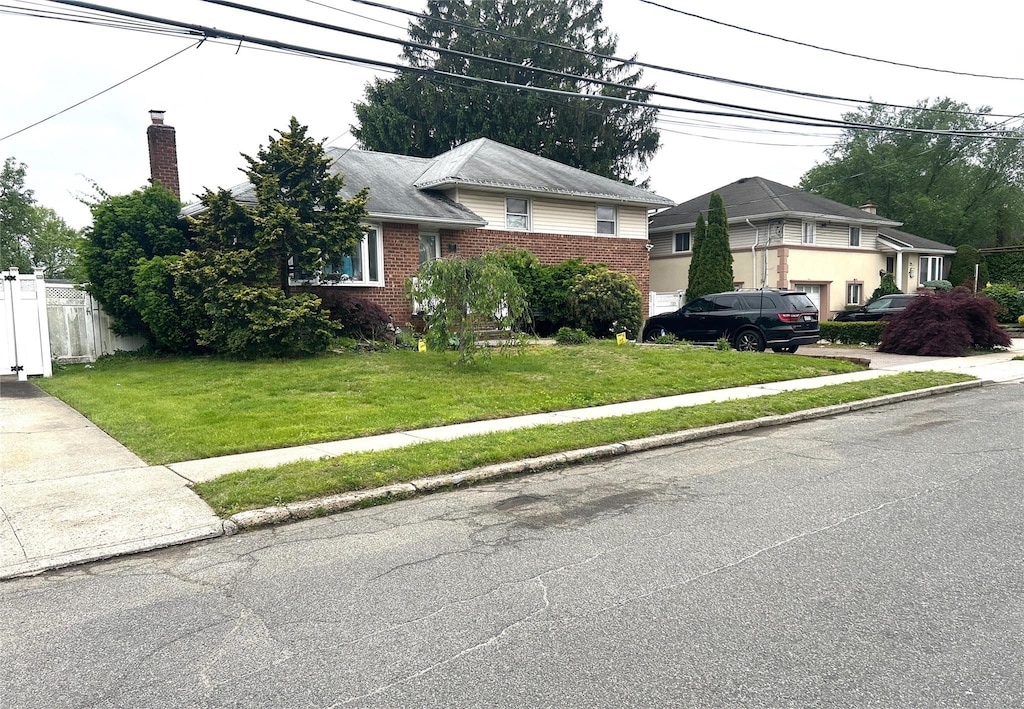 11 Berryhill Ln, Bethpage, NY 11714 - split level home featuring brick siding and a chimney