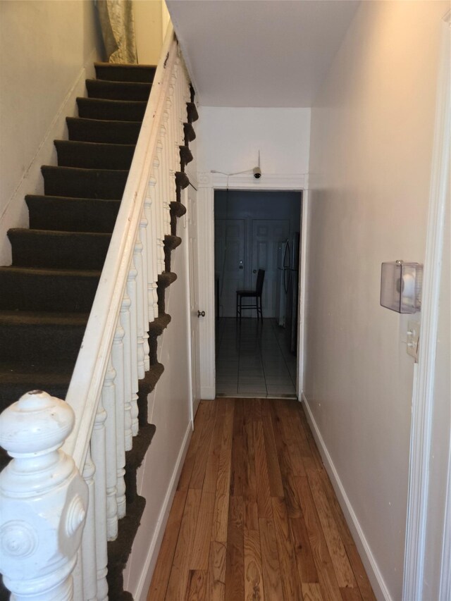 731 E 218th St, Bronx, NY 10467 - staircase with wood finished floors and baseboards