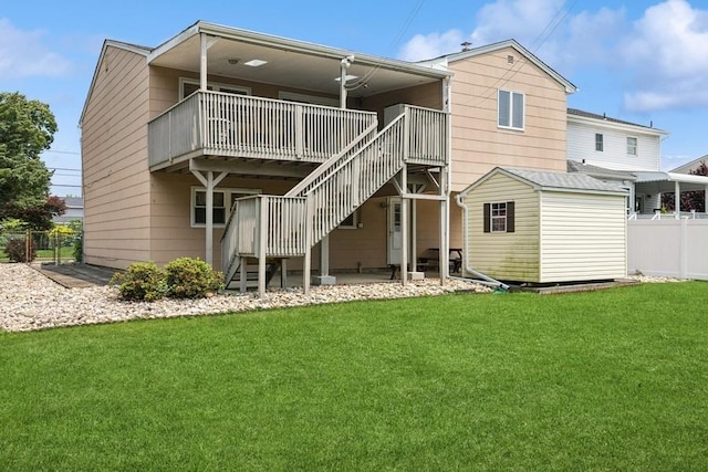 473 S 15th St, Lindenhurst, NY 11757 - rear view of house with stairs, a storage shed, and a wooden deck