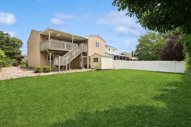 473 S 15th St, Lindenhurst, NY 11757 - back of property with stairs, a storage shed, a fenced backyard, and a wooden deck