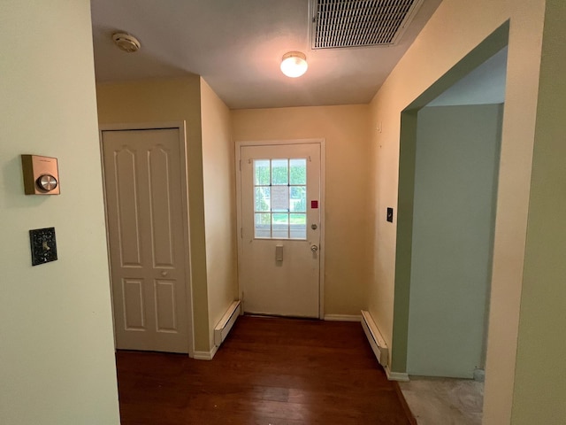 9 Forge Ln, Coram, NY 11727 - entryway featuring a baseboard radiator, wood finished floors, and baseboards