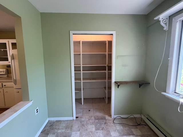 9 Forge Ln, Coram, NY 11727 - spacious closet featuring a baseboard heating unit