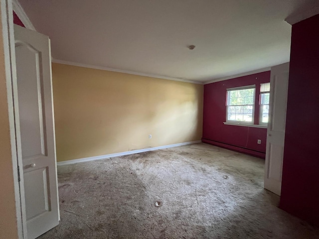 9 Forge Ln, Coram, NY 11727 - carpeted empty room featuring crown molding, baseboards, and a baseboard radiator