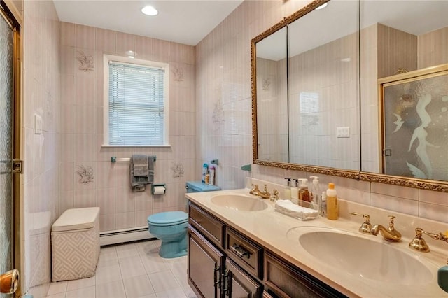 156 Valentine St, Yonkers, NY 10704 - bathroom featuring tile walls, a baseboard radiator, toilet, a stall shower, and double vanity