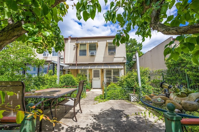 124 Herzl St, Brooklyn, NY 11212 - rear view of property featuring a patio, outdoor dining space, and cooling unit