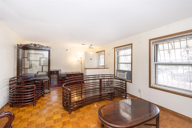 124 Herzl St, Brooklyn, NY 11212 - living room with baseboards and cooling unit