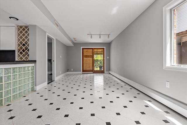 162-25 89th St, Howard Beach, NY 11414 - entryway with a baseboard heating unit and track lighting