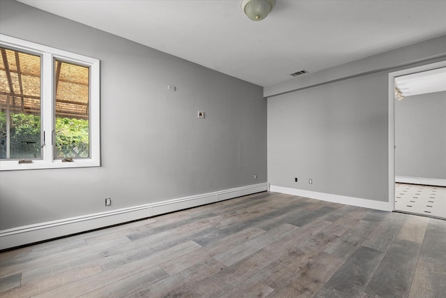 162-25 89th St, Howard Beach, NY 11414 - unfurnished room featuring wood finished floors and baseboard heating
