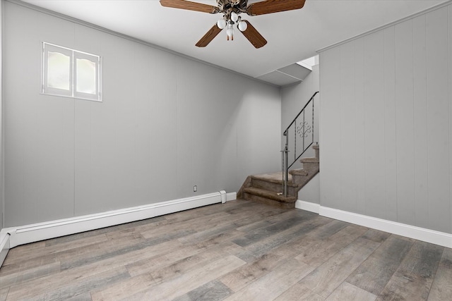 162-25 89th St, Howard Beach, NY 11414 - basement featuring wood finished floors, ceiling fan, stairway, and baseboard heating