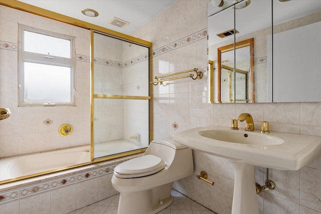 162-25 89th St, Howard Beach, NY 11414 - full bath featuring tile walls, tile patterned floors, and tiled shower / bath