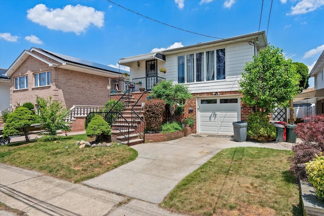 162-25 89th St, Howard Beach, NY 11414 - view of front of property featuring brick siding, a garage, driveway, and a front lawn